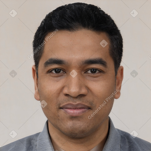 Joyful latino young-adult male with short  black hair and brown eyes