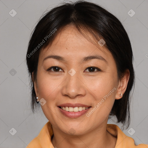 Joyful asian young-adult female with medium  brown hair and brown eyes