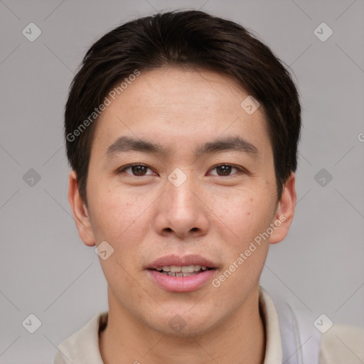 Joyful asian young-adult male with short  brown hair and brown eyes