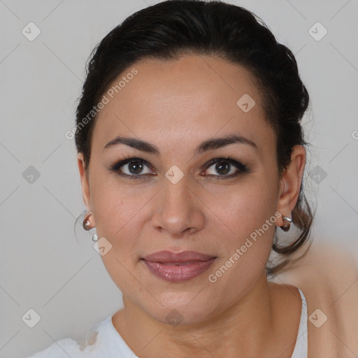 Joyful latino young-adult female with medium  brown hair and brown eyes