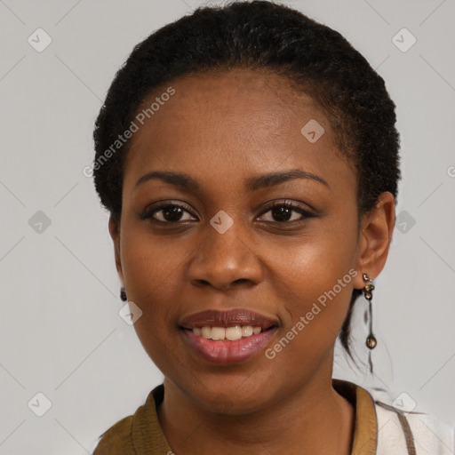 Joyful black young-adult female with short  brown hair and brown eyes