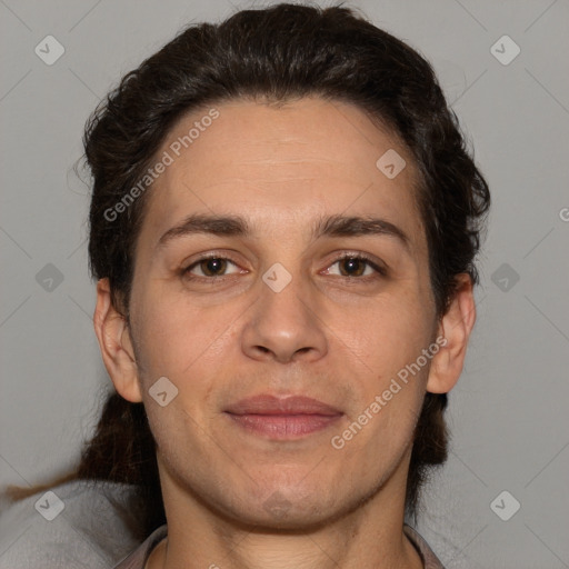 Joyful white adult male with short  brown hair and brown eyes