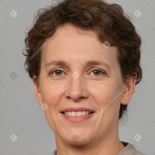 Joyful white adult female with short  brown hair and brown eyes