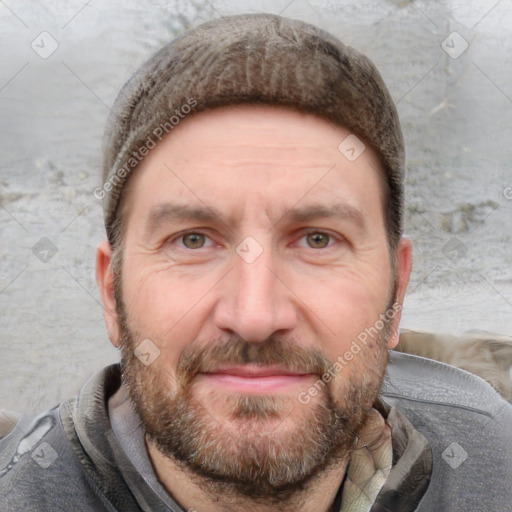 Joyful white adult male with short  brown hair and grey eyes