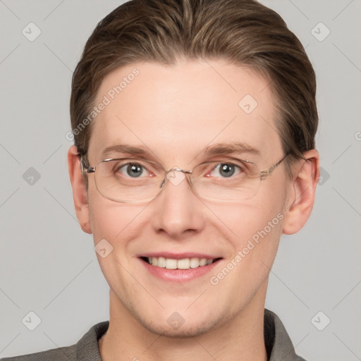 Joyful white adult male with short  brown hair and grey eyes