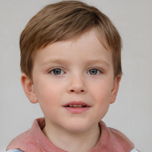 Joyful white child male with short  brown hair and blue eyes