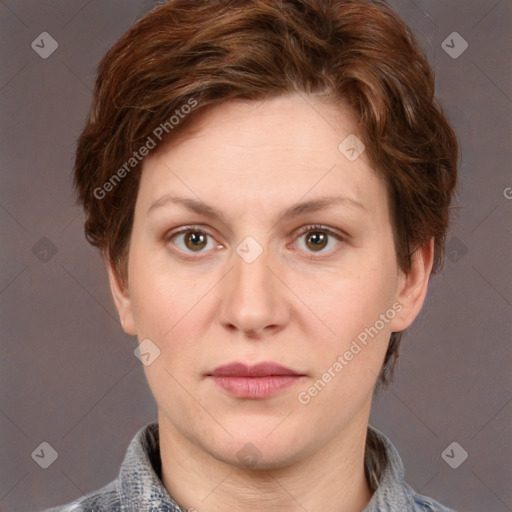 Joyful white adult female with short  brown hair and grey eyes