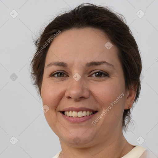 Joyful white adult female with short  brown hair and brown eyes