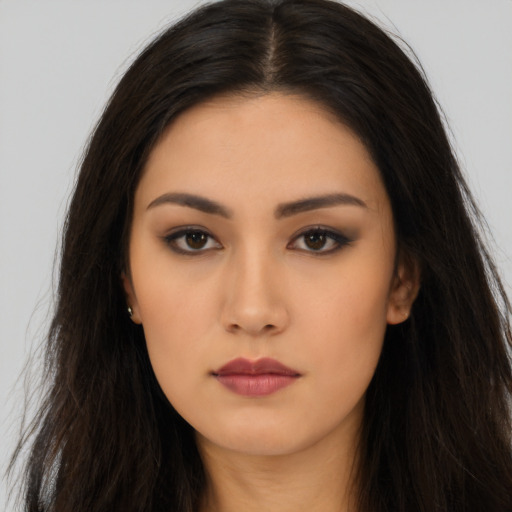 Neutral latino young-adult female with long  brown hair and brown eyes