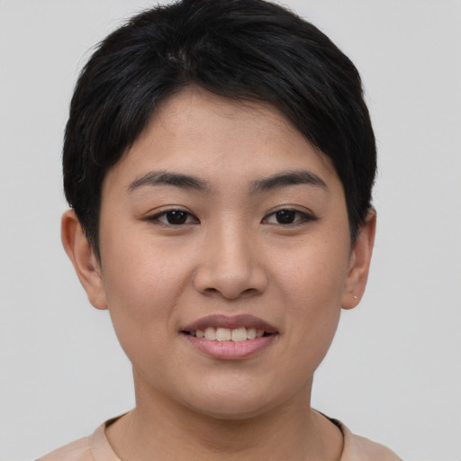 Joyful asian young-adult female with short  brown hair and brown eyes