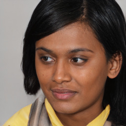 Joyful asian young-adult female with medium  black hair and brown eyes