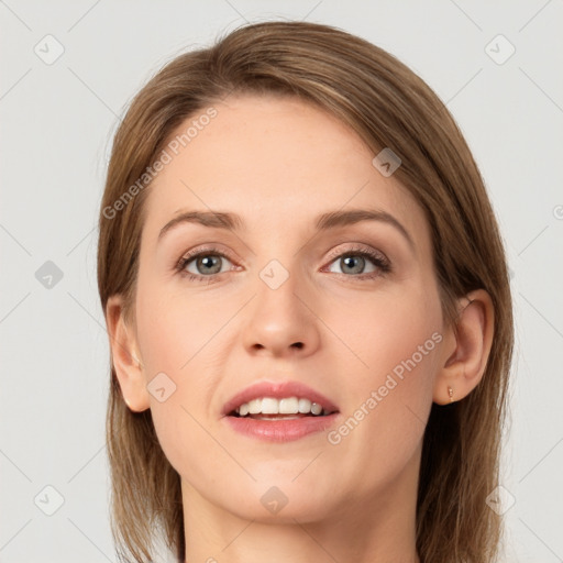 Joyful white young-adult female with long  brown hair and grey eyes