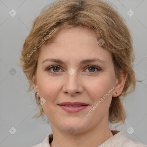 Joyful white young-adult female with medium  brown hair and blue eyes