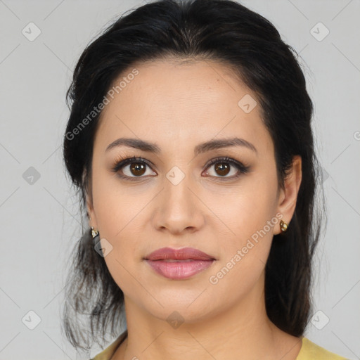 Joyful latino young-adult female with medium  brown hair and brown eyes