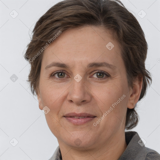 Joyful white adult female with short  brown hair and grey eyes