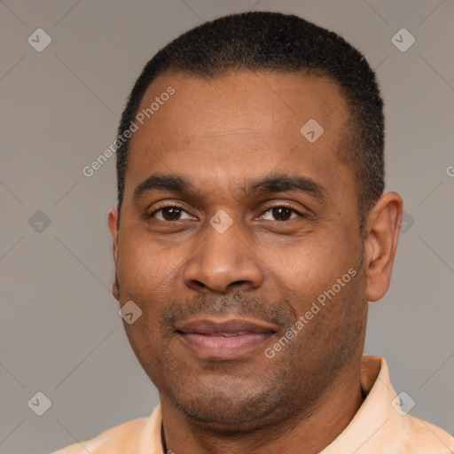 Joyful latino adult male with short  black hair and brown eyes