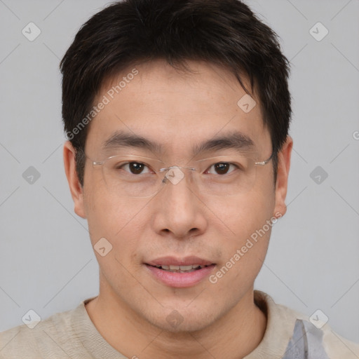 Joyful asian young-adult male with short  brown hair and brown eyes