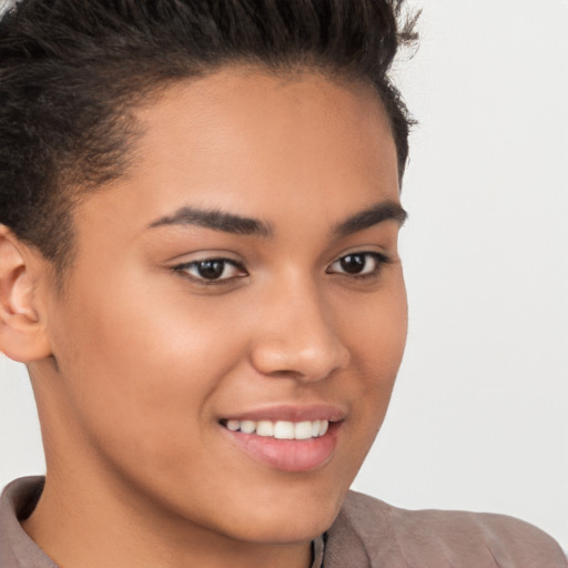 Joyful latino young-adult female with short  brown hair and brown eyes