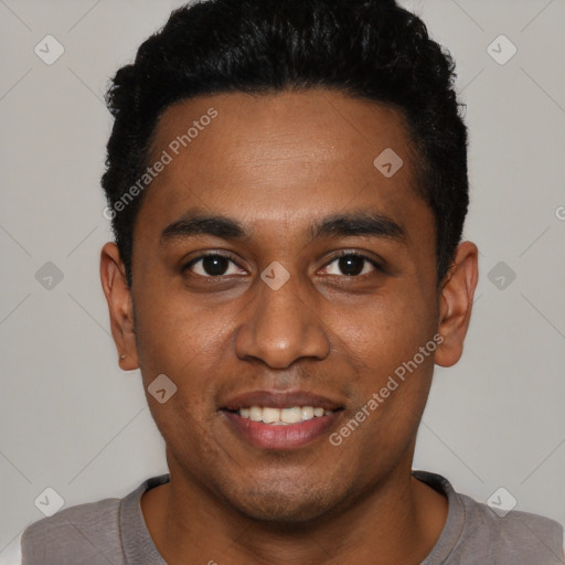 Joyful black young-adult male with short  black hair and brown eyes