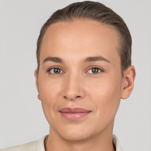 Joyful white young-adult female with short  brown hair and brown eyes