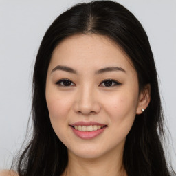 Joyful asian young-adult female with long  brown hair and brown eyes