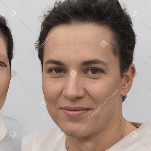 Joyful white adult female with short  brown hair and brown eyes