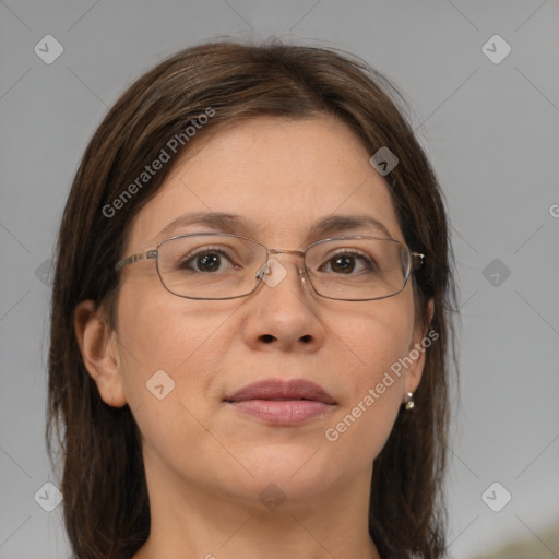 Joyful white adult female with medium  brown hair and brown eyes