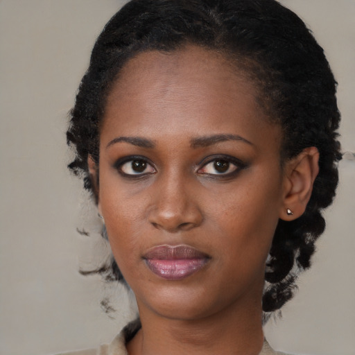 Neutral black young-adult female with short  black hair and brown eyes