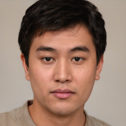 Neutral asian young-adult male with short  brown hair and brown eyes