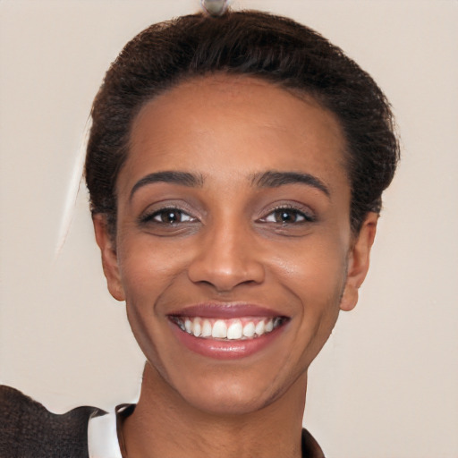 Joyful white young-adult female with short  brown hair and brown eyes