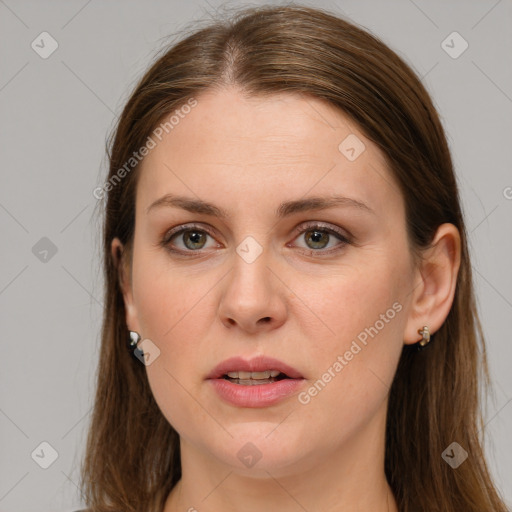 Joyful white young-adult female with long  brown hair and grey eyes