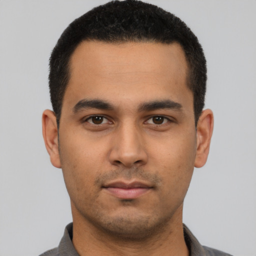 Neutral latino young-adult male with short  black hair and brown eyes