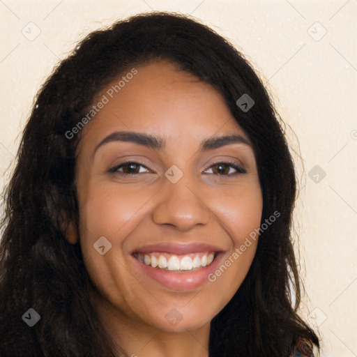 Joyful latino young-adult female with long  brown hair and brown eyes