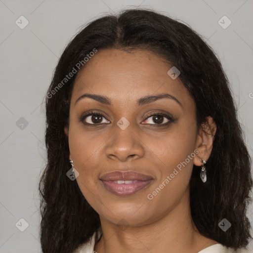 Joyful black young-adult female with long  brown hair and brown eyes