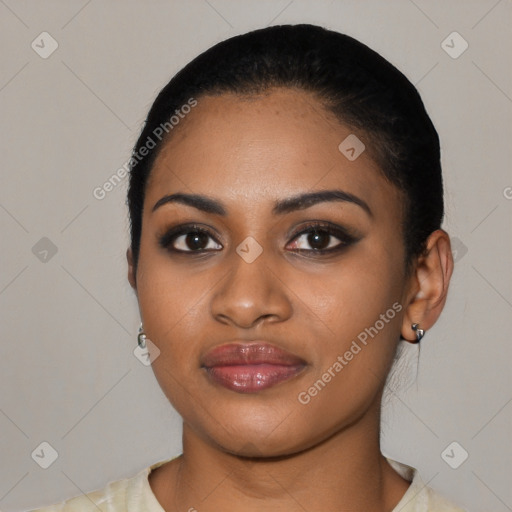 Joyful latino young-adult female with short  black hair and brown eyes