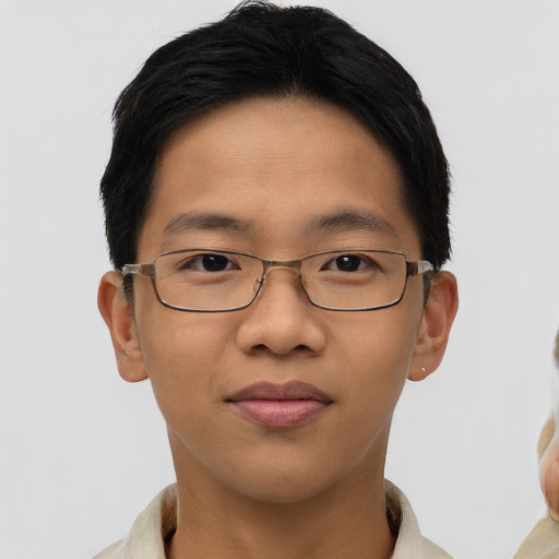 Joyful asian young-adult male with short  black hair and brown eyes