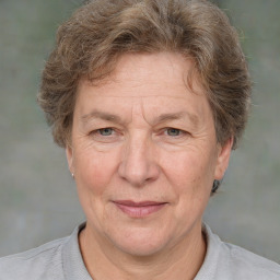 Joyful white middle-aged female with short  brown hair and brown eyes