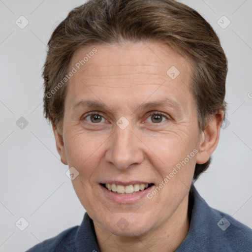 Joyful white adult male with short  brown hair and grey eyes