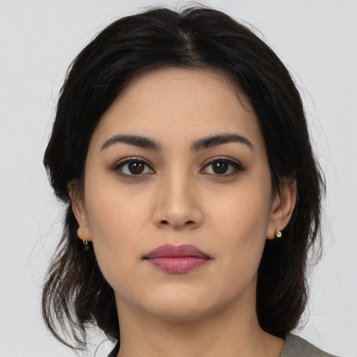 Neutral latino young-adult female with medium  black hair and brown eyes