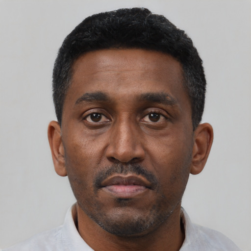 Neutral black young-adult male with short  black hair and brown eyes