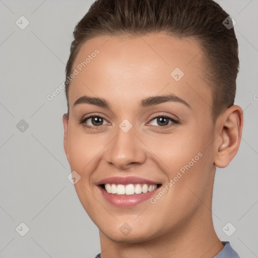 Joyful white young-adult female with short  brown hair and brown eyes