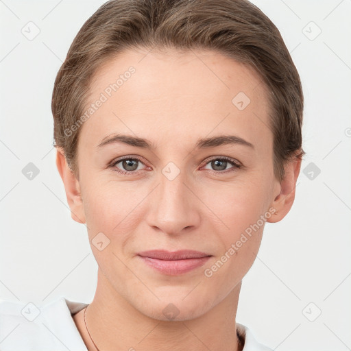 Joyful white young-adult female with short  brown hair and brown eyes