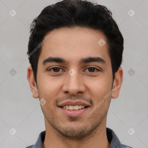 Joyful white young-adult male with short  black hair and brown eyes