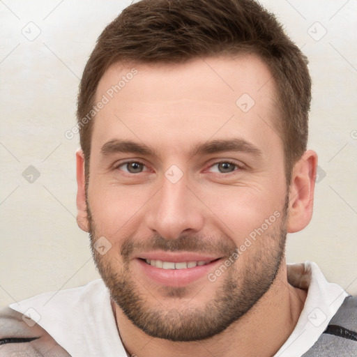 Joyful white young-adult male with short  brown hair and brown eyes