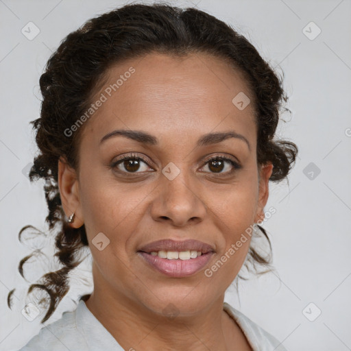 Joyful black adult female with medium  brown hair and brown eyes