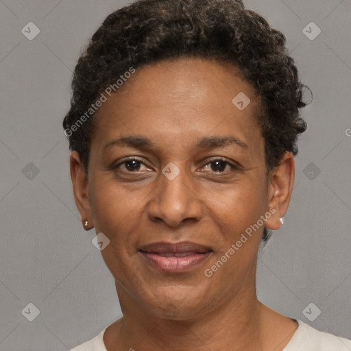 Joyful black adult female with short  brown hair and brown eyes