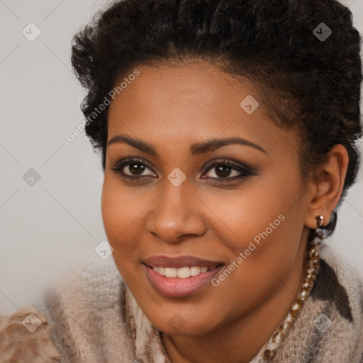 Joyful black young-adult female with short  brown hair and brown eyes