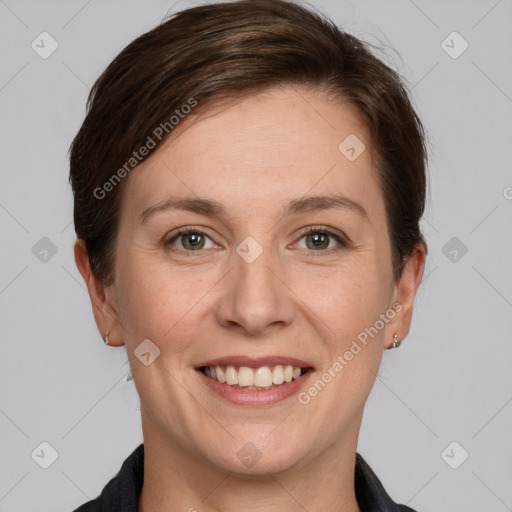 Joyful white young-adult female with short  brown hair and grey eyes