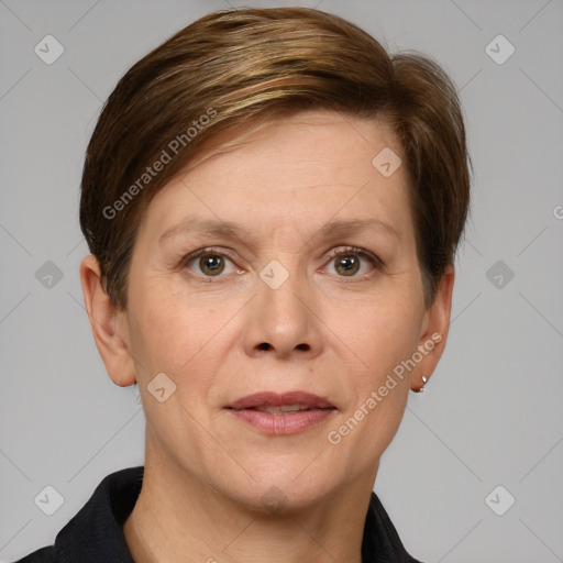 Joyful white adult female with short  brown hair and grey eyes