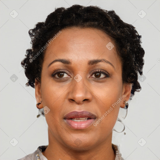 Joyful black adult female with short  brown hair and brown eyes